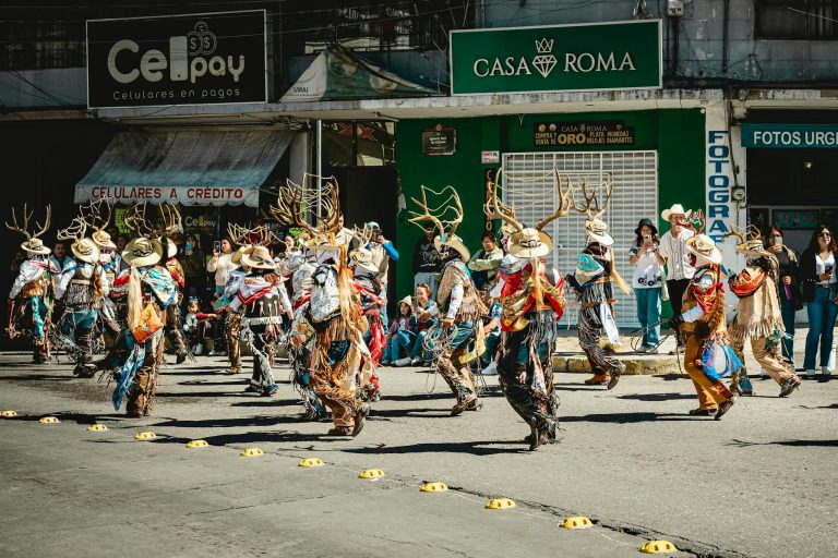 Vibrant traditional dance performance on the streets of Pachuca, México, capturing cultural heritage and festive spirit.